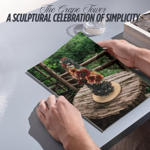 Grape Tower centerpiece with fresh grapes and seasonal florals by Charqute